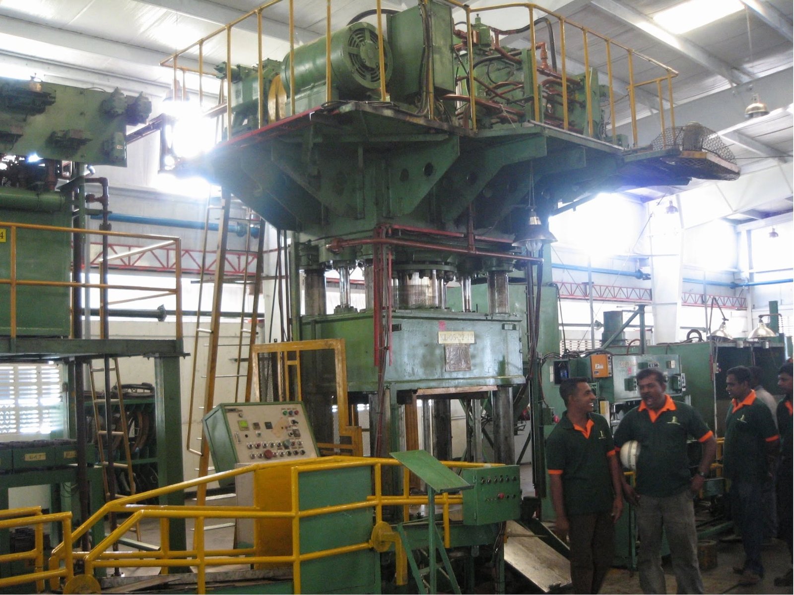 Large hydraulic press installation inside a Sri Lankan factory